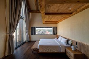 Postel nebo postele na pokoji v ubytování NTVILLA HỒ XUÂN HƯƠNG Đà Lạt + 123 fotografií