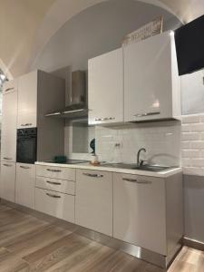 Η κουζίνα ή μικρή κουζίνα στο Serio Arcadiae +3 φωτογραφίες