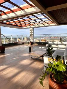 a living room with a view of the city at Studio New York in Imbituba