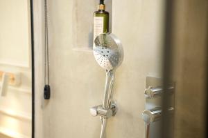 a bottle of wine is hanging on a door at Moonlight Apartments Tirana in Tirana +48 photos