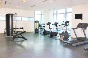 a gym with several treadmills and cardio machines at 8Adriatico Condo near US Embassy in Manila
