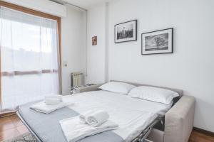 Postel nebo postele na pokoji v ubytování Bilocale 436