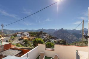 a view of the mountains from the balcony of a house at Casa Lea Artenara in Artenara