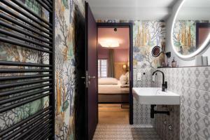 a bathroom with a sink and a mirror at Ranunkelhof in Pirna +110 photos