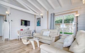 a living room with a couch and a table at Villa Karla by Villas Vista Gomera in Adeje