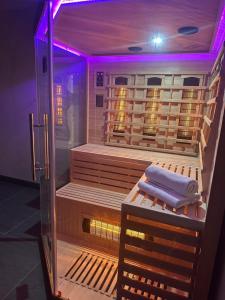 a sauna with a purple light in a room at Vacation Home Mo Star with Swimming pool and Sauna in Mostar