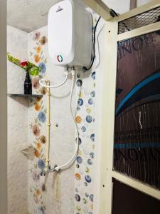 a shower in a bathroom with a shower at Next Home Stay in Nalkhera +19 photos