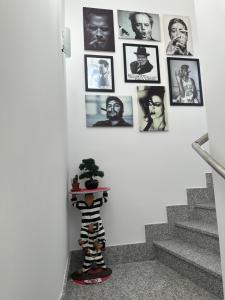 a room with pictures on the wall and a skeleton on a shelf at Edificio Resort Gran8Nerja in Nerja +95 photos
