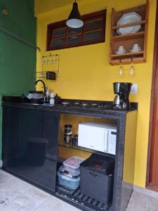 Nhà bếp/bếp nhỏ tại Sal Studio - Centro RJ