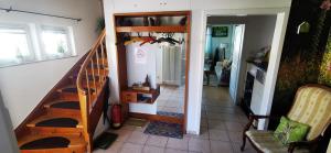 a hallway with a staircase and a room with a stair case at Ferienwohnung Palmenwald in Freudenstadt