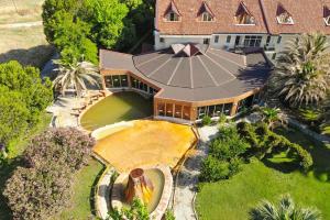 an overhead view of a large house with a large backyard at Lycus River Thermal Hotel in Pamukkale