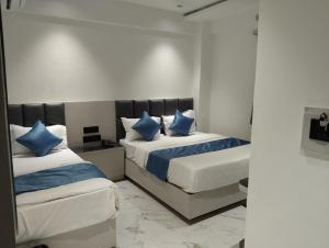 Postel nebo postele na pokoji v ubytování Hotel Palliate Inn