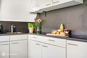 Η κουζίνα ή μικρή κουζίνα στο Familiehuis op een rustig park