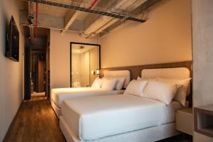 Una cama o camas en una habitación de Uukam by Bernalo Hotels 14 fotos más