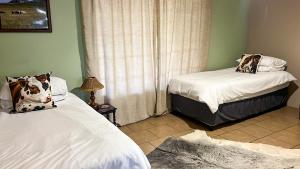 En eller flere senge i et værelse på Lynthorn Farm Cottage