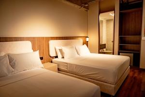 Una cama o camas en una habitación de Uukam by Bernalo Hotels