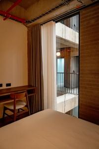 Una cama o camas en una habitación de Uukam by Bernalo Hotels