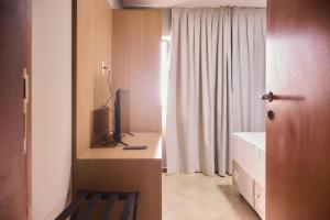 Ένα ή περισσότερα κρεβάτια σε δωμάτιο στο Apartamento Completo Quarto/ Sala/Cozinha/ Banheiro Mobiliado - WS Urban Ed. Celita Franca