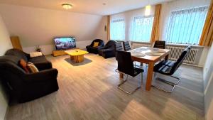 TV a/nebo společenská místnost v ubytování Ferienwohnung Auguste