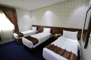 Кровать или кровати в номере Maysan Al Safa Hotel