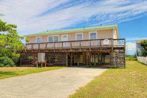 a large house with a deck on top of it at 4140 - Beach Carousel in Kitty Hawk