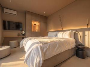 En eller flere senge i et værelse på Guesthouse Ubuntu - Stellenbosch