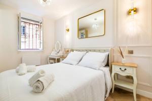 En eller flere senge i et værelse på Magnifique 3 chambres 3 SDE avec Clim et Jacuzzi