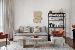 a living room with a couch and a coffee table at Pereh Mountain Resort in Gadot