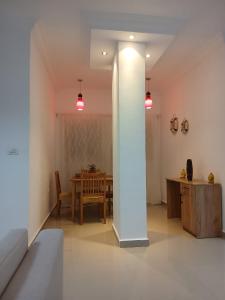 a living room with a table and a white pillar at Sea View 2 Bedroom Apartment in El-Hadaba in Hurghada