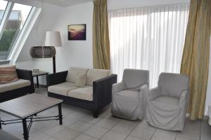 Χώρος καθιστικού στο Rust,zee,strand 6-persoons villa met sauna