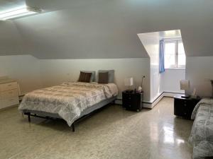 En eller flere senge i et værelse på Le Couvent