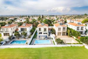 an aerial view of a house with a pool at Villa Waves in Mazotos