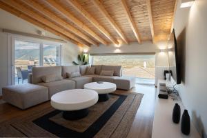 a living room with a couch and a table at Suite Room 33 Ioannina - Near airport in Ioannina