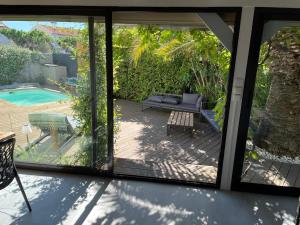 a view of a patio from a sliding glass door at L 'Évasion in Saint-Cyprien