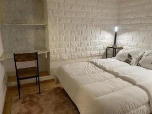 Una cama o camas en una habitación de Appartement confortable à Aigues-Mortes – 30 m²
