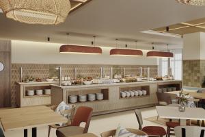 a restaurant with tables and chairs and a buffet at Alua Linda Mallorca in Can Pastilla +8 photos