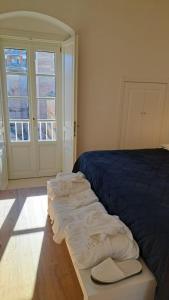 Giường trong phòng chung tại Antica Dimora Petito Luxury Suites