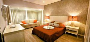 En eller flere senge i et værelse på T3 1 Lote 9 Beira Mar - Casas & Papéis