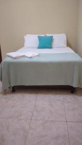 En eller flere senge i et værelse på Hotel João de Barro