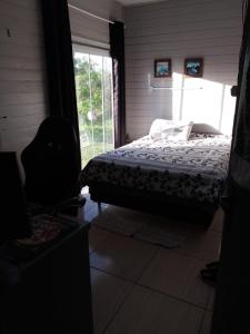 Postel nebo postele na pokoji v ubytování Casa praia