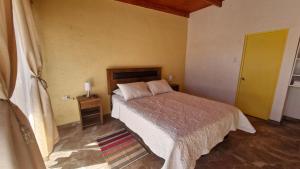 Ένα ή περισσότερα κρεβάτια σε δωμάτιο στο Eltoconar atacama