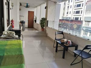 a room with a table and chairs and a window at NOVA HOTEL Bukit Bintang in Kuala Lumpur