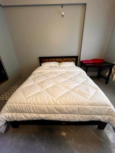 Postel nebo postele na pokoji v ubytování Amelie Apartments and Stay Inn + 1 fotografie