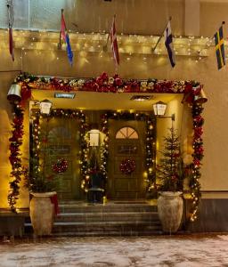 an entrance to a building with christmas decorations at Hotel Jämteborg in Östersund