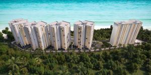 uma vista aérea de edifícios altos perto do oceano em Mango tree residence em Dar es Salaam