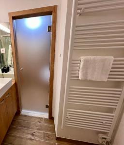 a bathroom with a towel hanging on a wall at Sunflower in Kranjska Gora