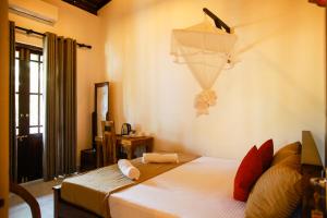 Postel nebo postele na pokoji v ubytování Casa De Chica Mirissa