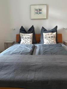 Кровать или кровати в номере Schmuckstück an der Wormser Stadtmauer