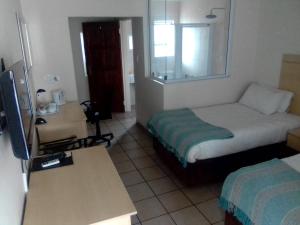 Et tv og/eller underholdning på Shalom Guest House