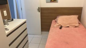 En eller flere senge i et værelse på Ap mobiliado Praia de Iracema